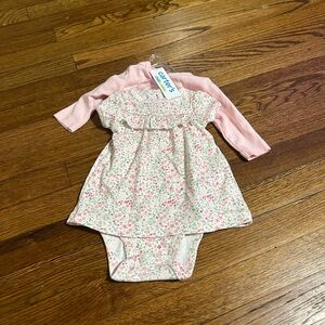 Lots of new baby clothes